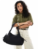 slouchy tote bag with tie pockets in black