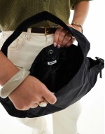 slouchy tote bag with tie pockets in black